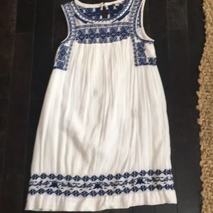 Lucky sundress with embroidered design.